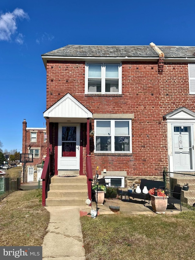 view of front of home featuring brick siding