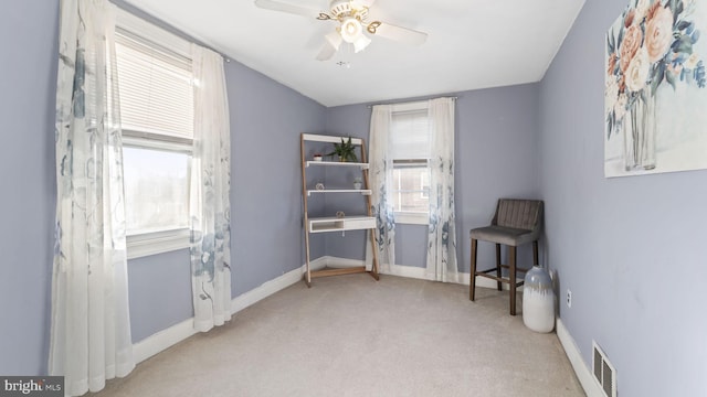 carpeted bedroom featuring visible vents, baseboards, and ceiling fan