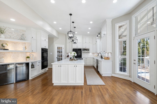 kitchen featuring open shelves, light countertops, wine cooler, white cabinets, and appliances with stainless steel finishes