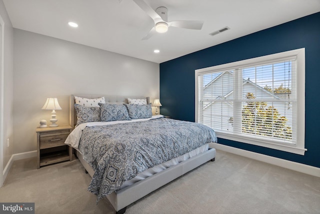 carpeted bedroom with recessed lighting, visible vents, baseboards, and a ceiling fan