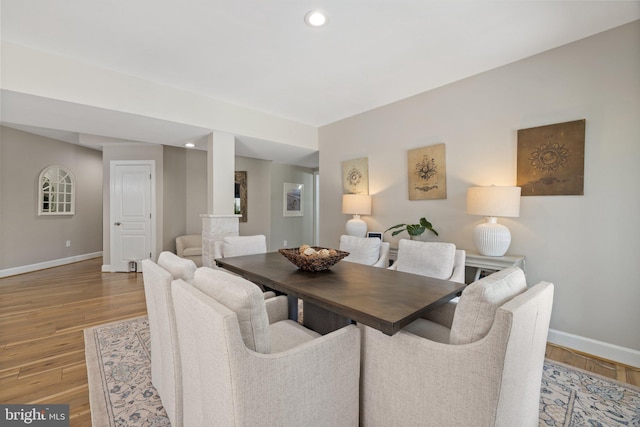 dining area with recessed lighting, baseboards, and wood finished floors