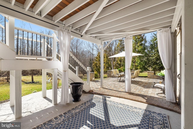 view of patio / terrace featuring stairway and outdoor dining space