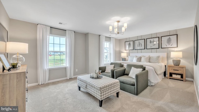 bedroom with light colored carpet, a notable chandelier, and baseboards