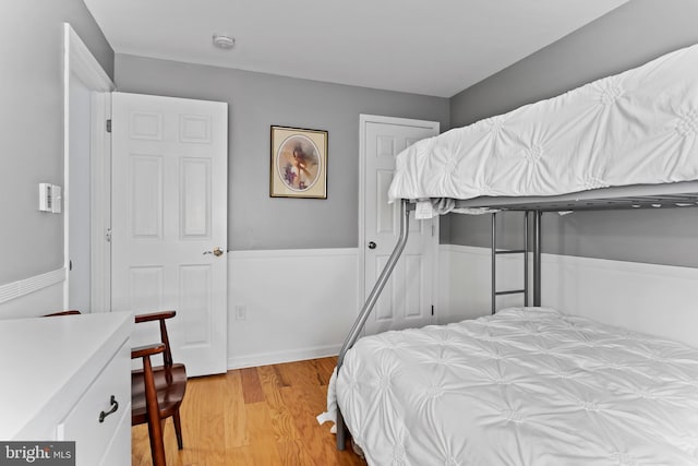 bedroom with light wood-style flooring and a closet