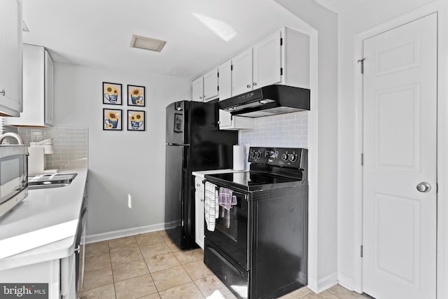 kitchen with black appliances, under cabinet range hood, white cabinetry, light countertops, and decorative backsplash