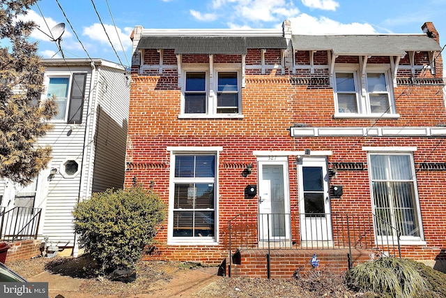 view of front of house featuring brick siding