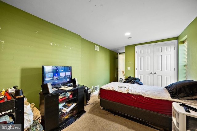 bedroom featuring a closet, carpet, and visible vents