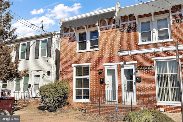 view of property with brick siding