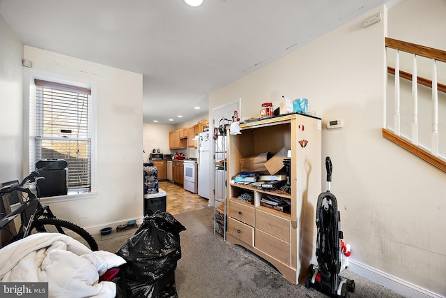 bedroom with baseboards, recessed lighting, and light colored carpet