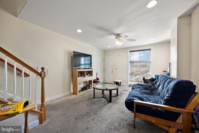 living room with stairway, carpet flooring, and baseboards