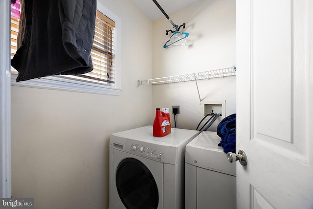 washroom with laundry area and separate washer and dryer