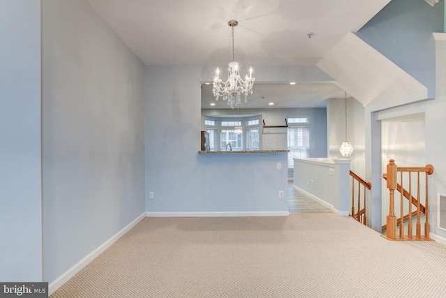 spare room with visible vents, baseboards, carpet floors, a chandelier, and recessed lighting