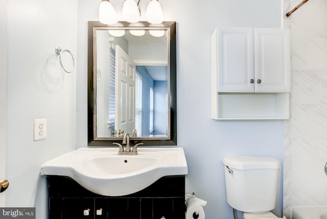 full bathroom featuring toilet and vanity