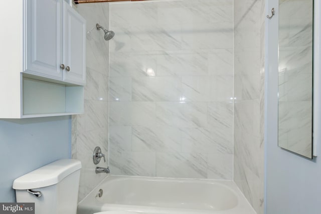 bathroom featuring toilet and bathtub / shower combination