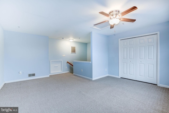 interior space with visible vents, ceiling fan, and baseboards