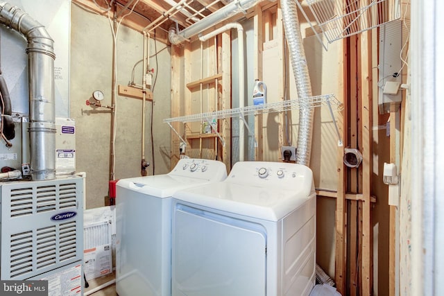 clothes washing area with laundry area and separate washer and dryer