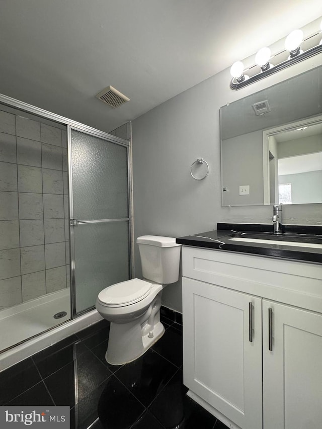 full bath with visible vents, toilet, a stall shower, and vanity