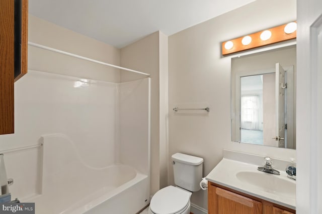 bathroom featuring shower / bathing tub combination, toilet, and vanity