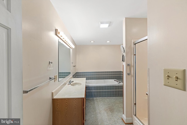 full bathroom with vanity, a garden tub, recessed lighting, and a stall shower