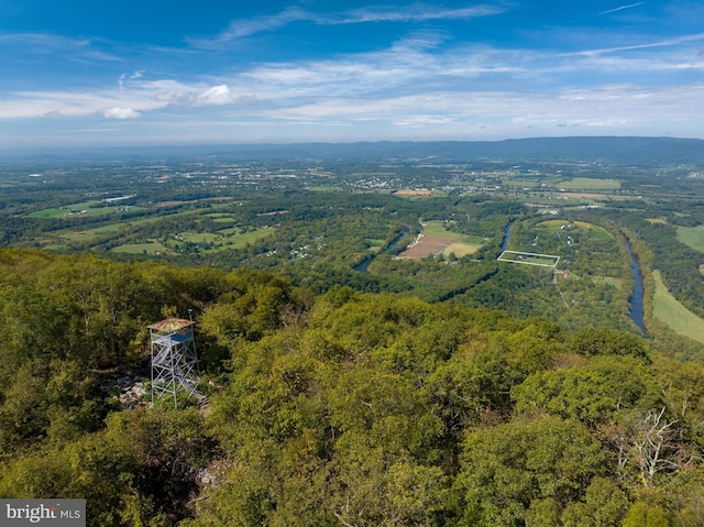 birds eye view of property with a wooded view