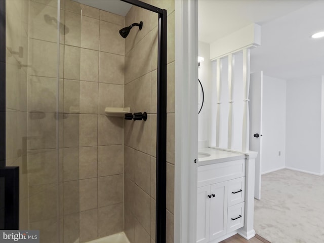 bathroom featuring a stall shower and vanity