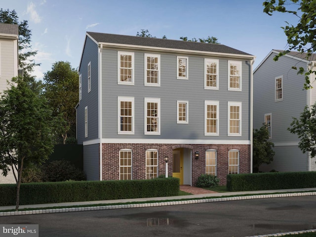 view of front of home featuring brick siding