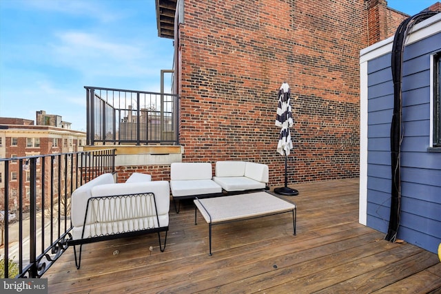 wooden terrace featuring an outdoor hangout area