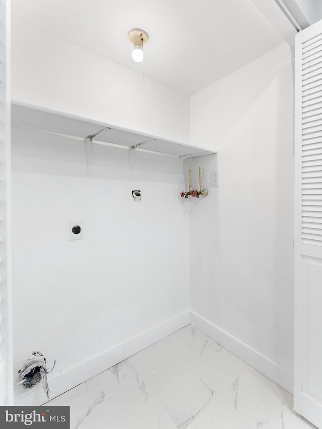 laundry room featuring marble finish floor, hookup for a washing machine, hookup for an electric dryer, laundry area, and baseboards