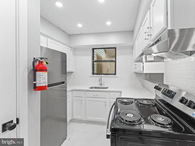 kitchen with a sink, stainless steel appliances, under cabinet range hood, white cabinetry, and backsplash