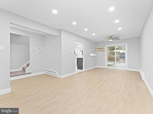 unfurnished living room featuring light wood-style flooring, stairway, baseboard heating, a baseboard heating unit, and recessed lighting