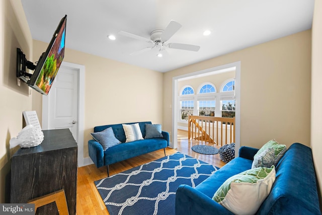 living area featuring recessed lighting, wood finished floors, and a ceiling fan