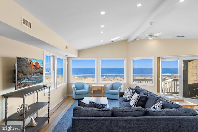 living area featuring lofted ceiling with beams, visible vents, wood finished floors, and recessed lighting