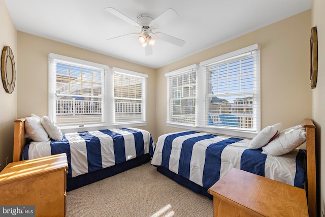 bedroom featuring a ceiling fan and carpet floors