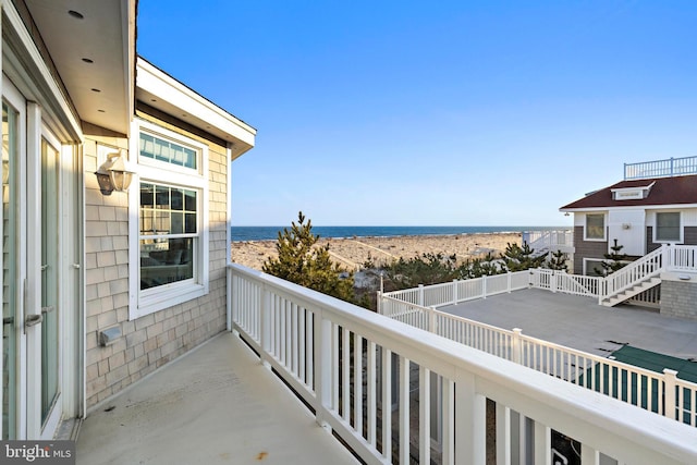 balcony featuring a water view