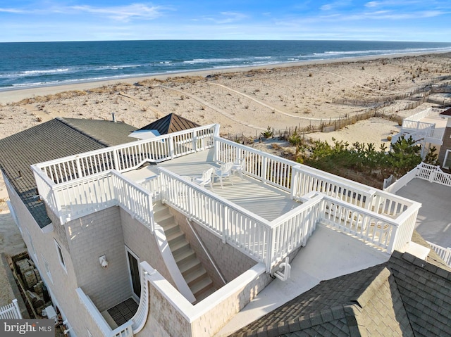 aerial view featuring a water view and a view of the beach