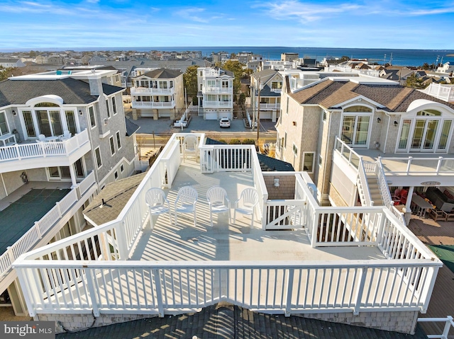 birds eye view of property featuring a water view and a residential view