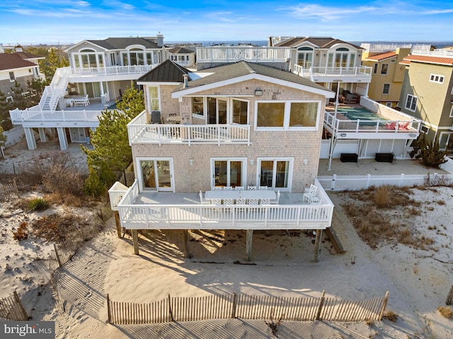 back of house with a balcony