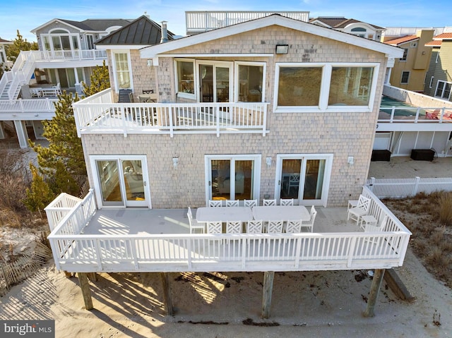 rear view of house featuring a balcony