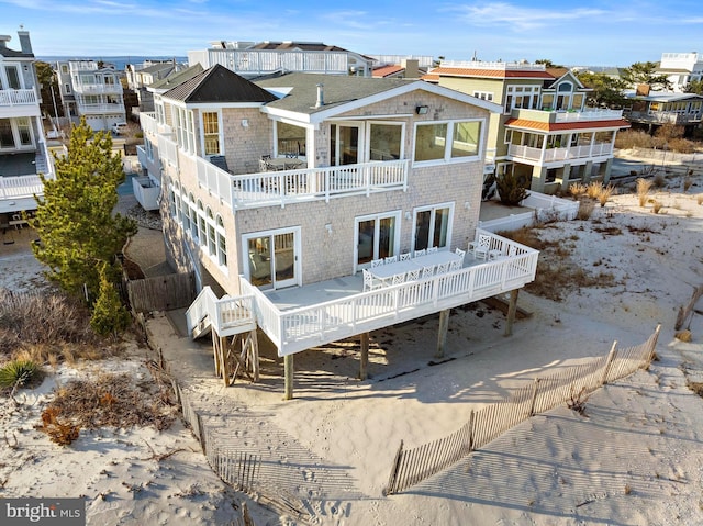 back of property featuring a residential view