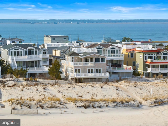 bird's eye view with a residential view and a water view