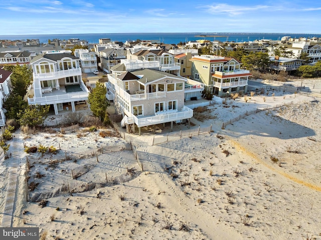 bird's eye view featuring a residential view and a water view