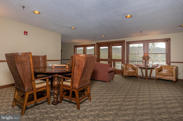 dining area featuring recessed lighting, carpet flooring, a textured ceiling, and baseboards