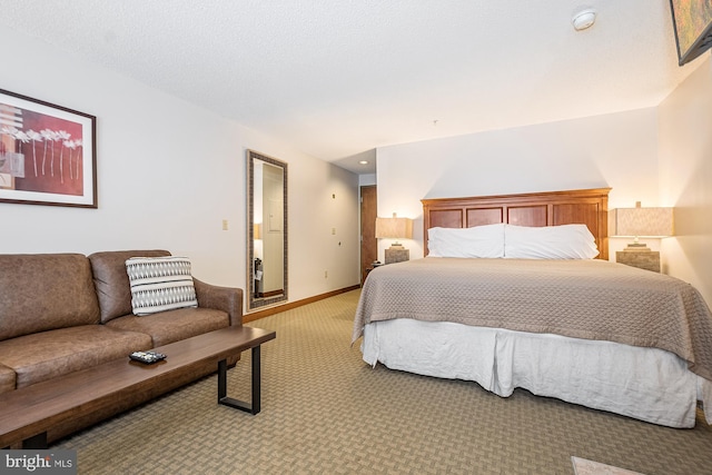 bedroom featuring light carpet and baseboards