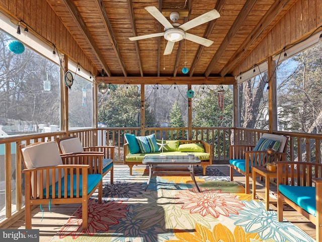 sunroom featuring a wealth of natural light, an outdoor hangout area, and ceiling fan