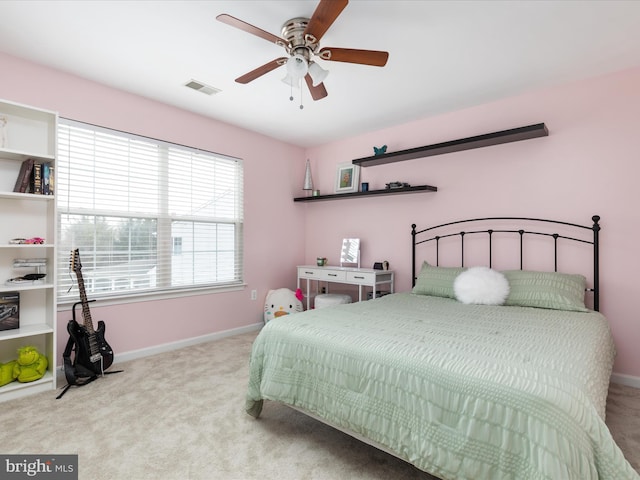 bedroom with baseboards, carpet flooring, ceiling fan, and visible vents