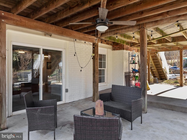 view of patio / terrace with an outdoor hangout area and stairs