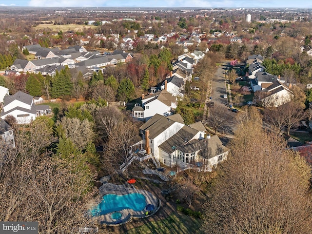 birds eye view of property with a residential view