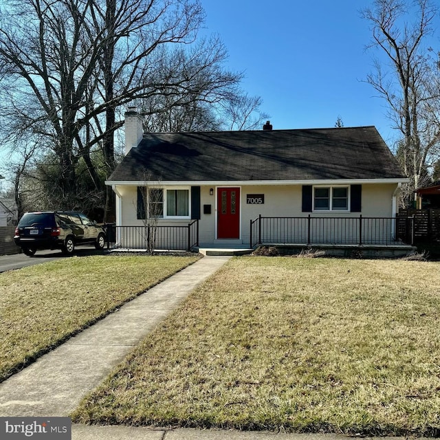 ranch-style home with a porch, a chimney, a front lawn, and stucco siding