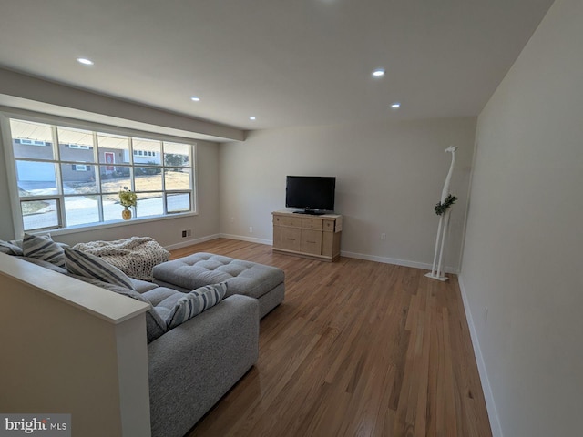 living room featuring visible vents, recessed lighting, wood finished floors, and baseboards