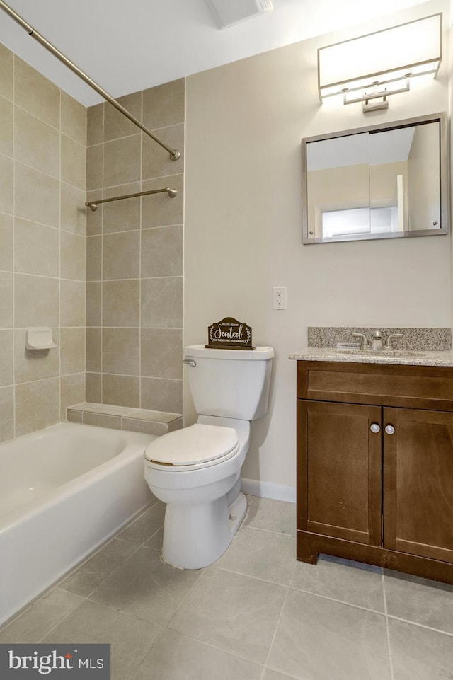 full bath featuring vanity, tile patterned floors, toilet, and shower / bathing tub combination